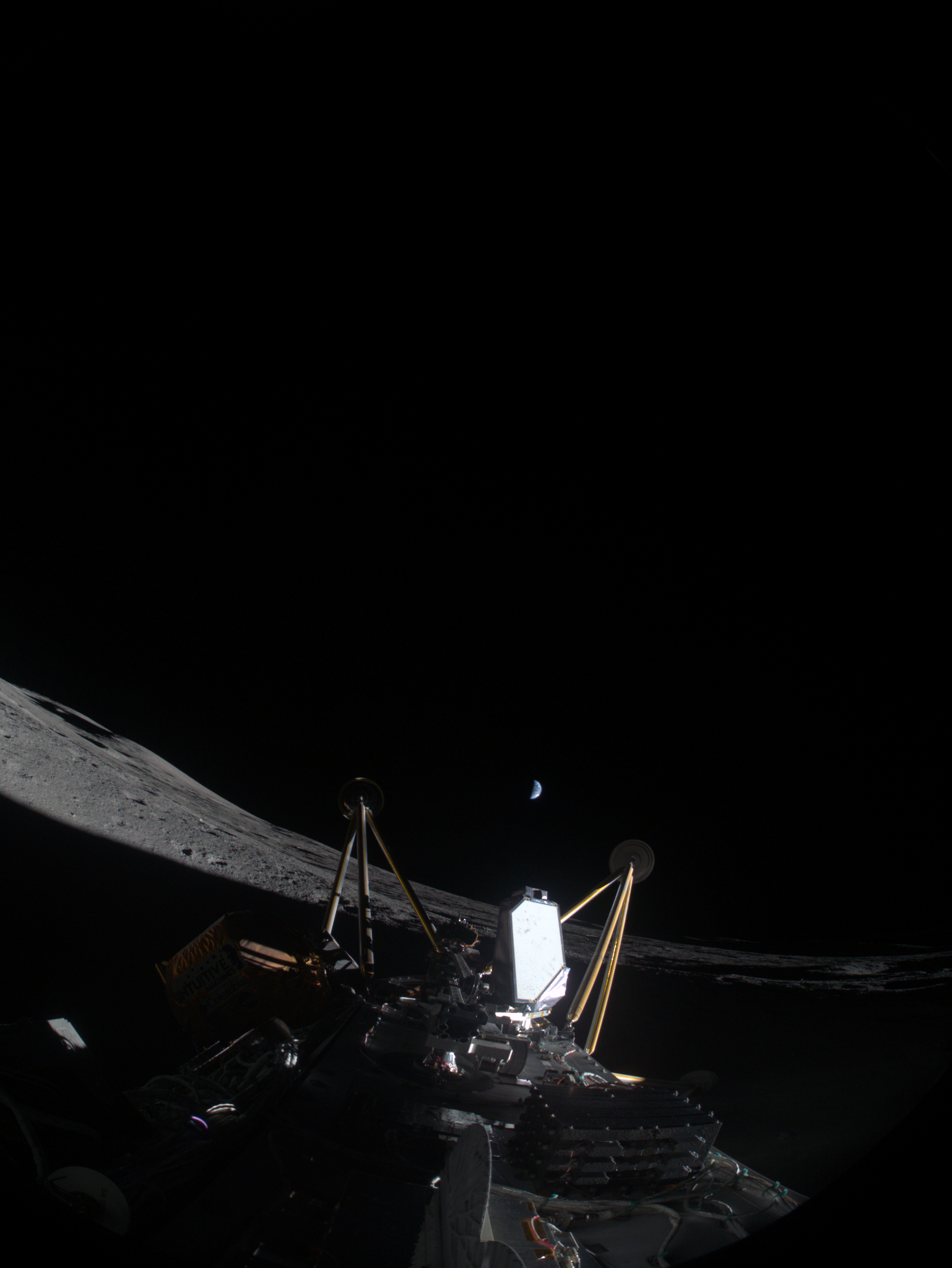 Intuitive Machines’ IM-2 captured an image March 6, 2025, after landing in a crater from the Moon’s South Pole. The lunar lander is on its side about 820 feet from the intended landing site, Mons Mouton. In the center of the image between the two lander legs is the Polar Resources Ice Mining Experiment 1 suite, which shows the drill deployed.