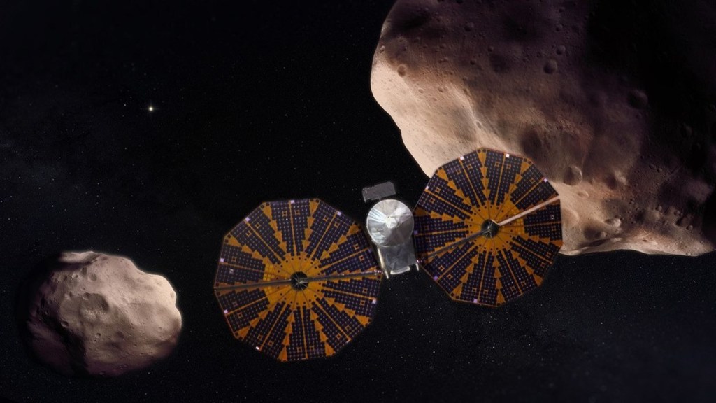 An illustration of the Lucy spacecraft flying by two of its asteroid targets.