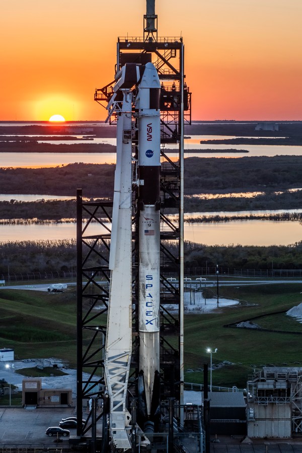 Image shows sunset with SpaceX rocket and spacecraft on Launch Pad 39A at NASA Kennedy Space Center in Florida on March 12.