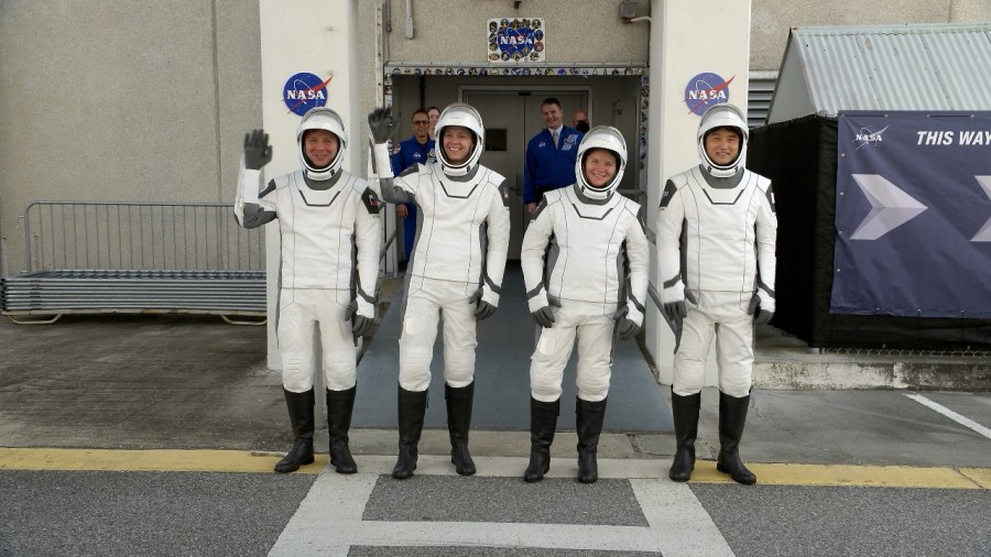 Image shows NASA's SpaceX Crew-10 astronauts waving to family and friends.