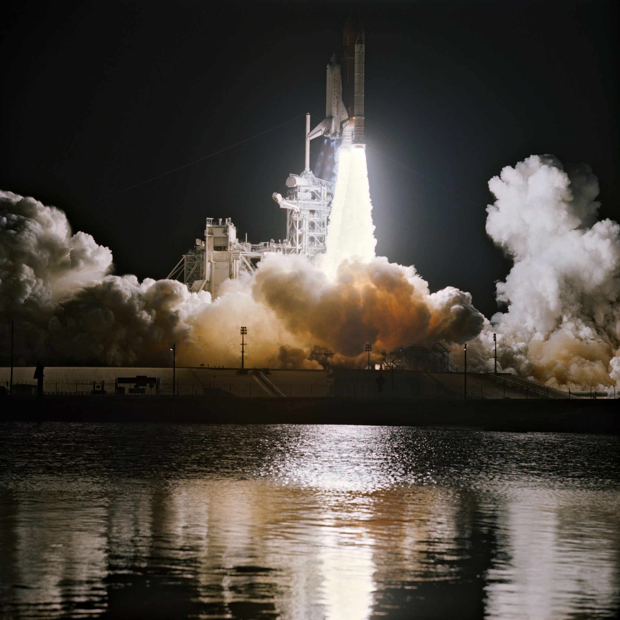 Photograph of a shuttle taking off at night.
