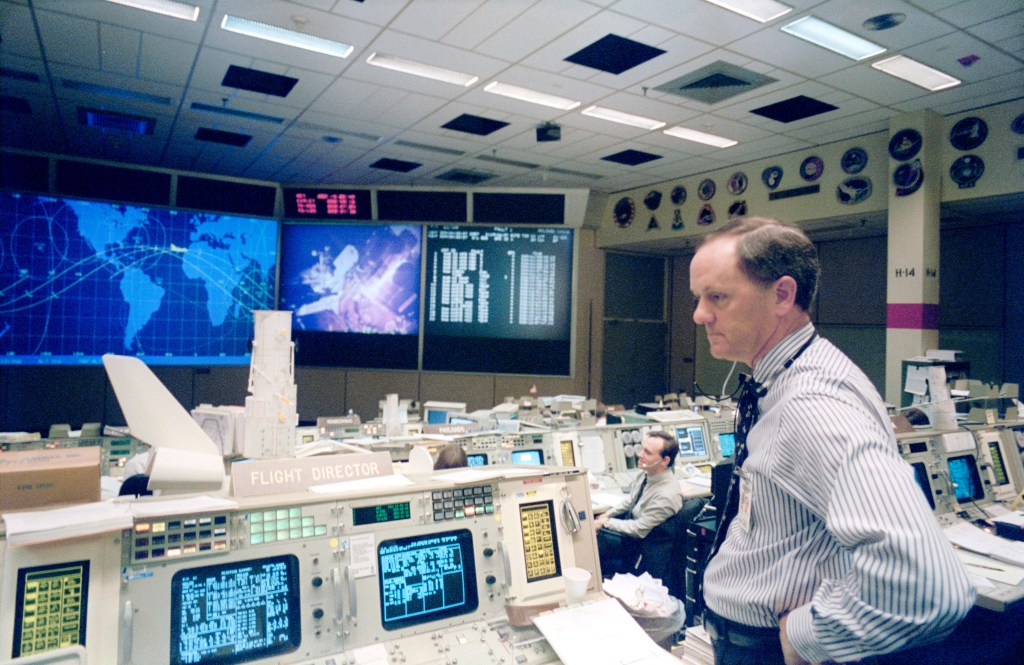 Flight Director Milton Heflin, at the console in the Flight Control Room in JSC's Mission Control Center