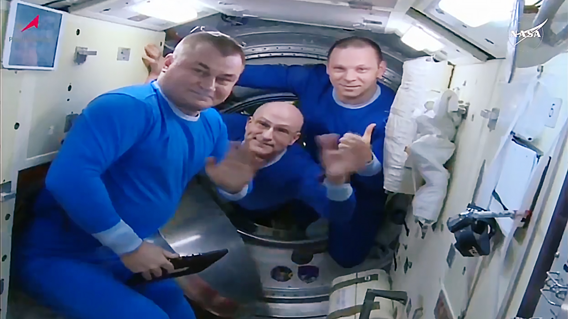(From left) Alexey Ovchinin of Roscosmos, Don Pettit of NASA, and Ivan Vagner of Roscosmos wave farewell before boarding their Soyuz MS-26 spacecraft for the ride back to Earth.