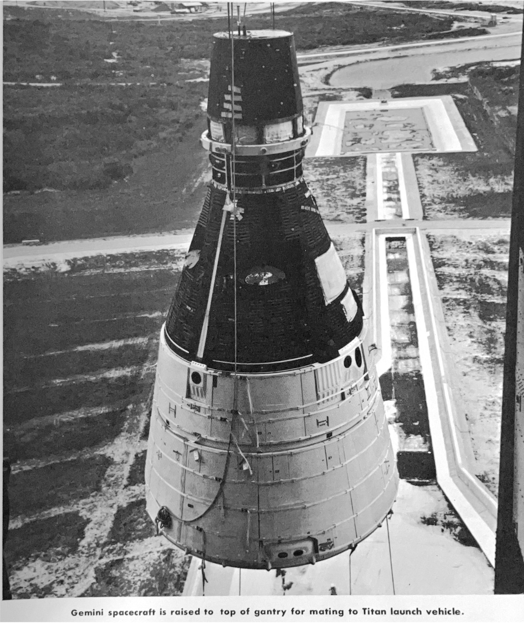 View of the gemini spacecraft as it is raised to the top of the gantry