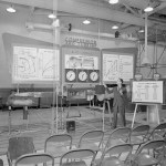 Man in front of display.