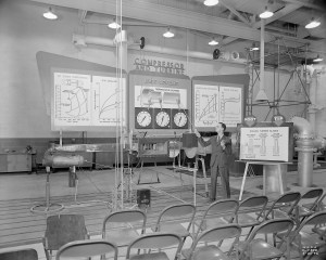 Man in front of display.