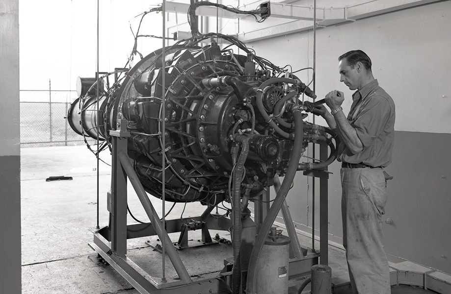 Man inspecting large jet engine.