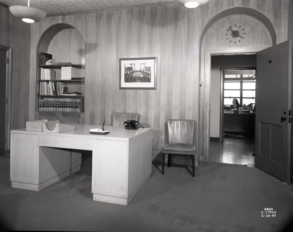 Paneled office with desk.