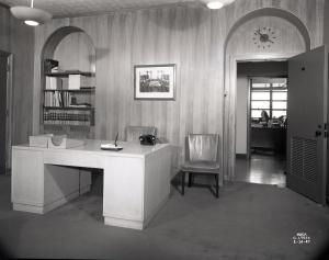 Paneled office with desk.