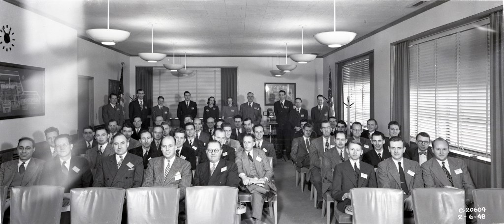 People seated in rows of chairs.