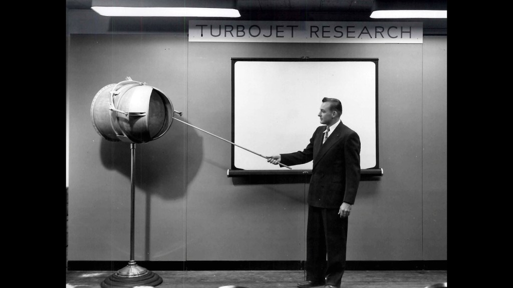 Man pointing to chart.