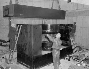 Crane lowering yoke into pit.