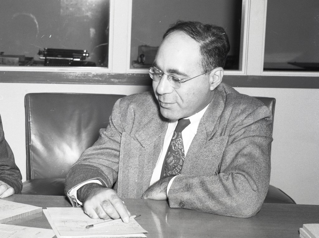 Man sitting at desk.