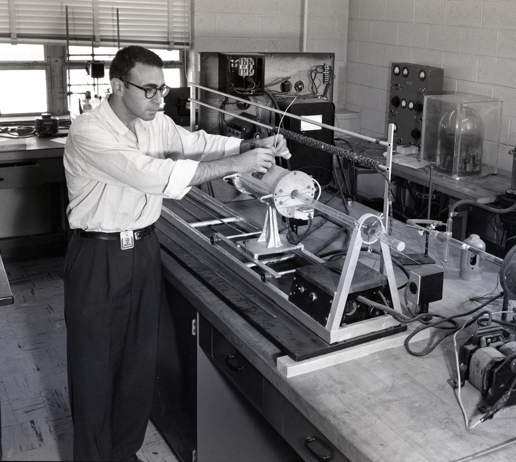 Man with test apparatus.