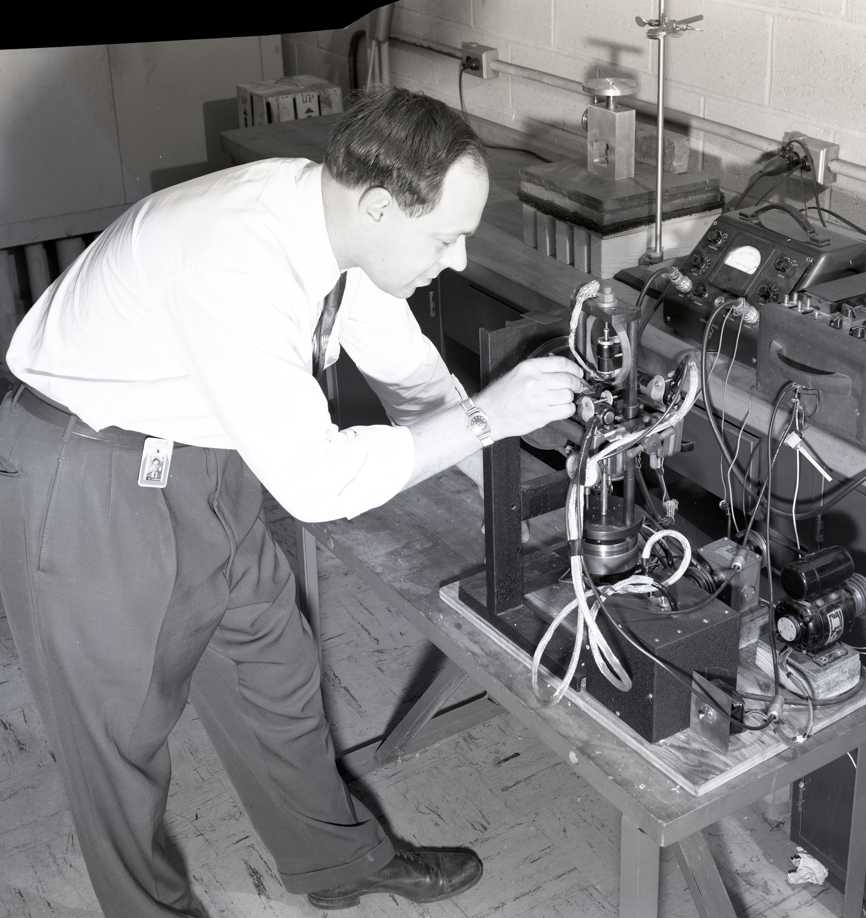 Man working on test equipment.