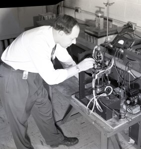 Man working on test equipment.