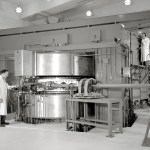 Researcher with cyclotron.