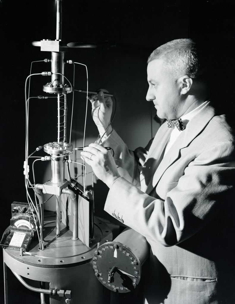 Man looking at test apparatus.