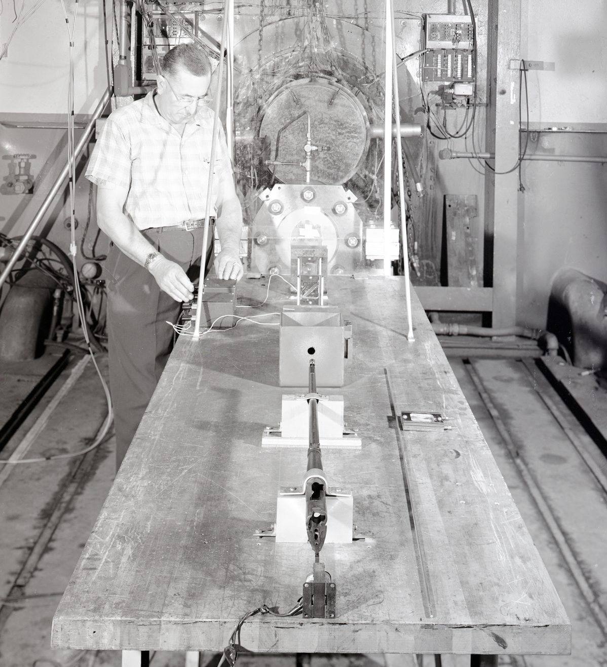 Man with table-mounted impact gun.