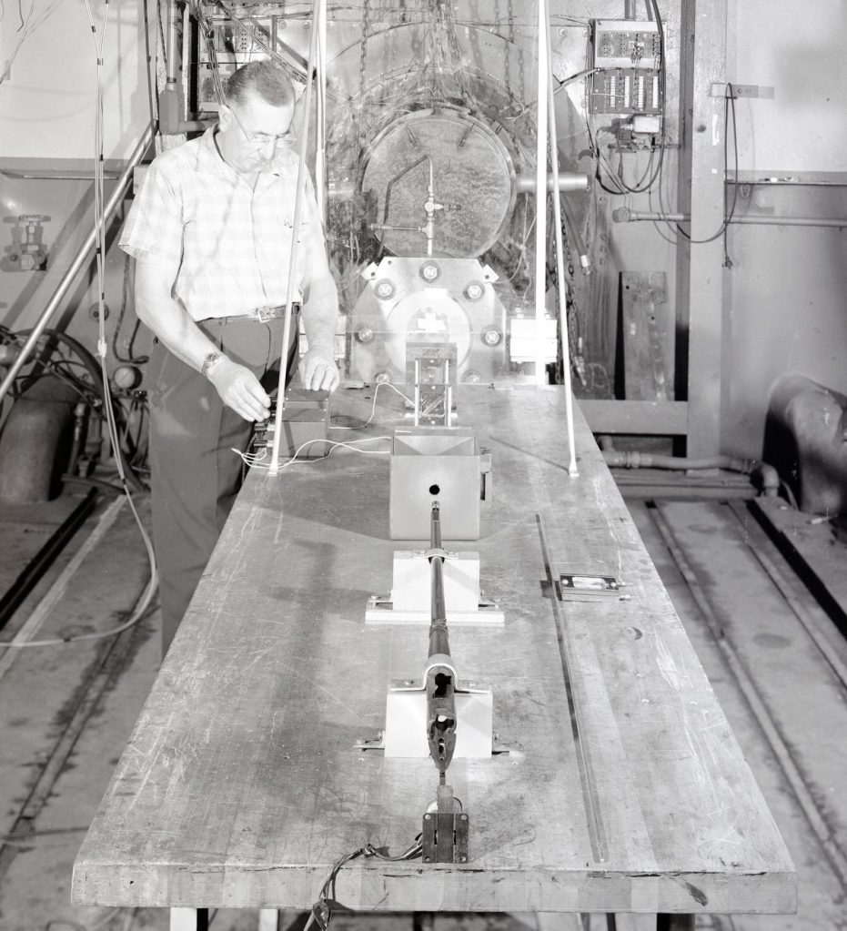 Man with table-mounted impact gun.