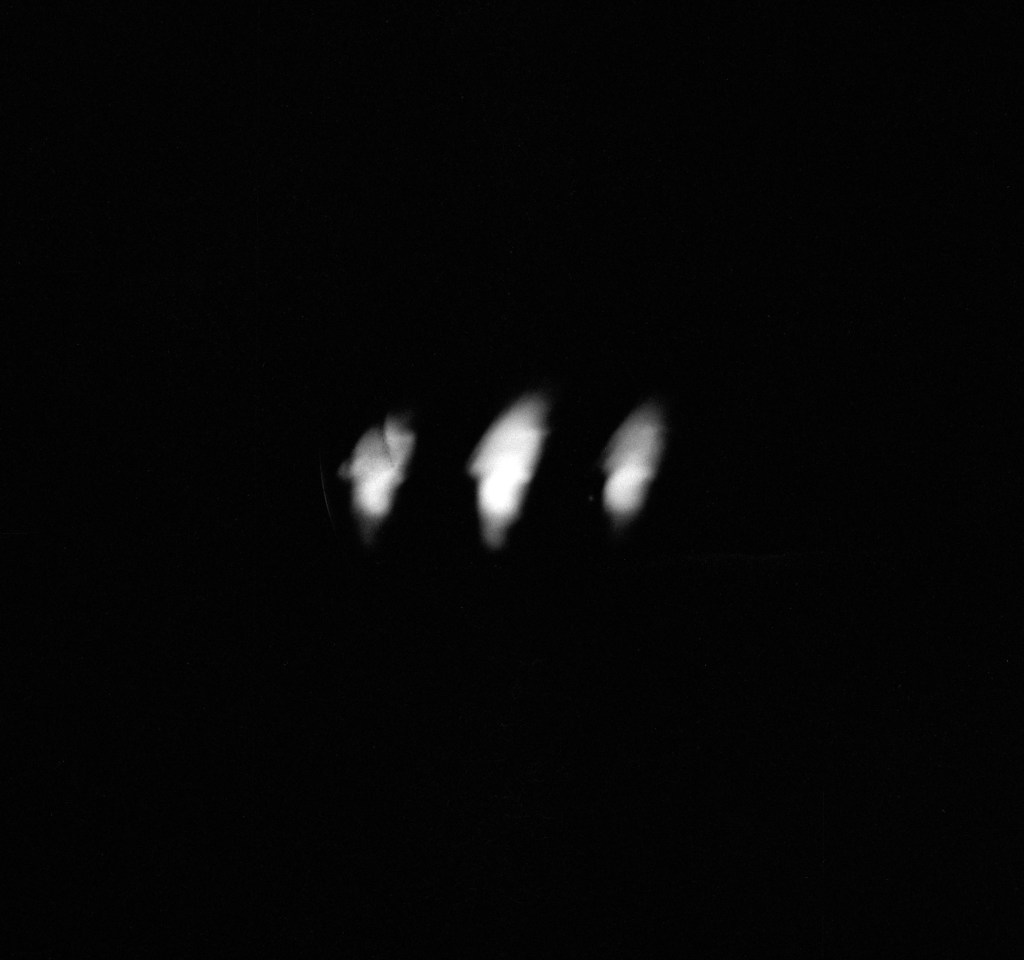 Beam spots against dark background.