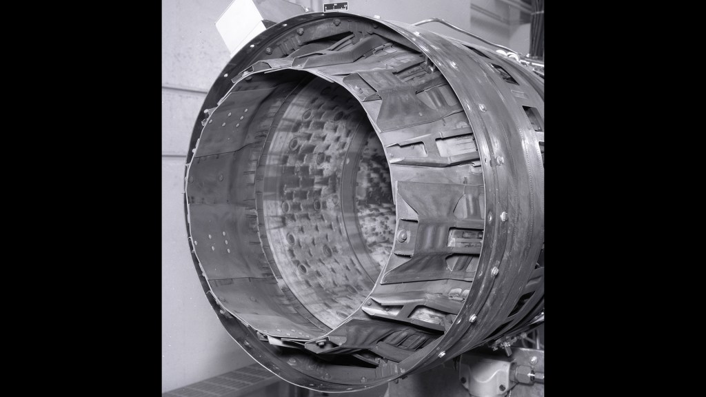 Close up of nozzle on jet engine.
