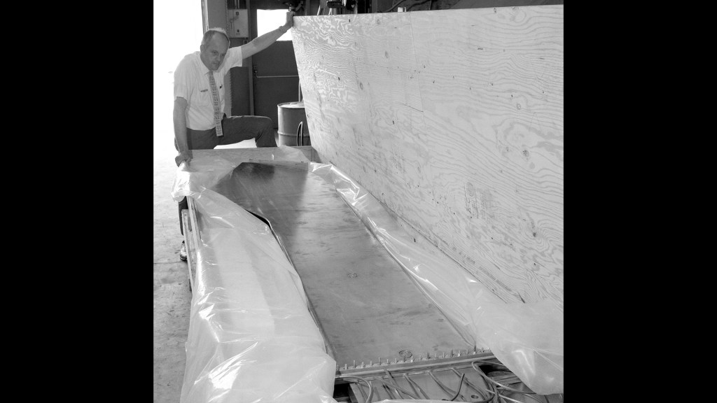 Researcher examines shipment.