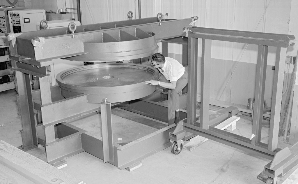Man examining equipment.