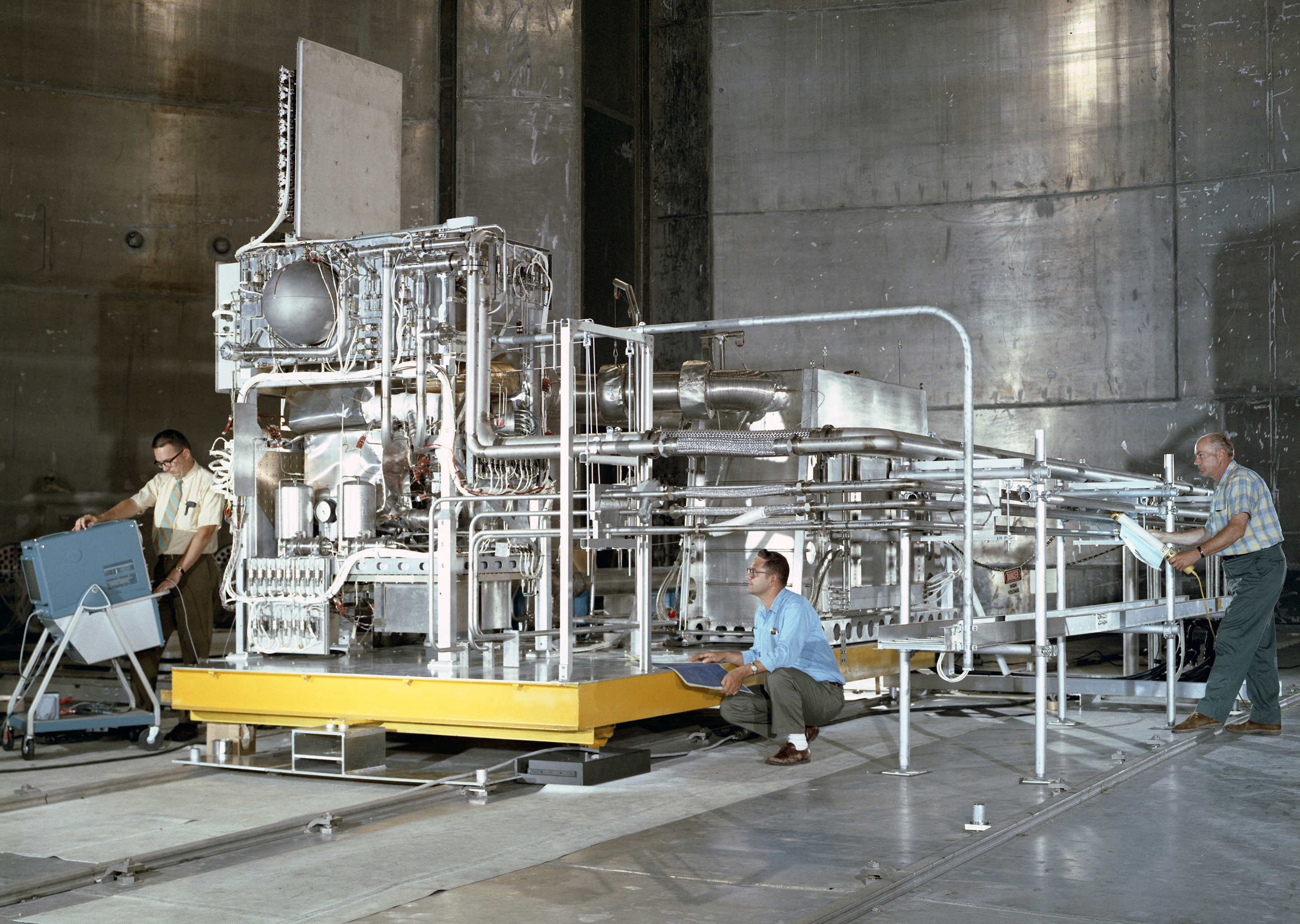 Test hardware inside large vacuum chamber.