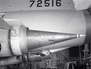 Close up of conical nozzle on aircraft engine.