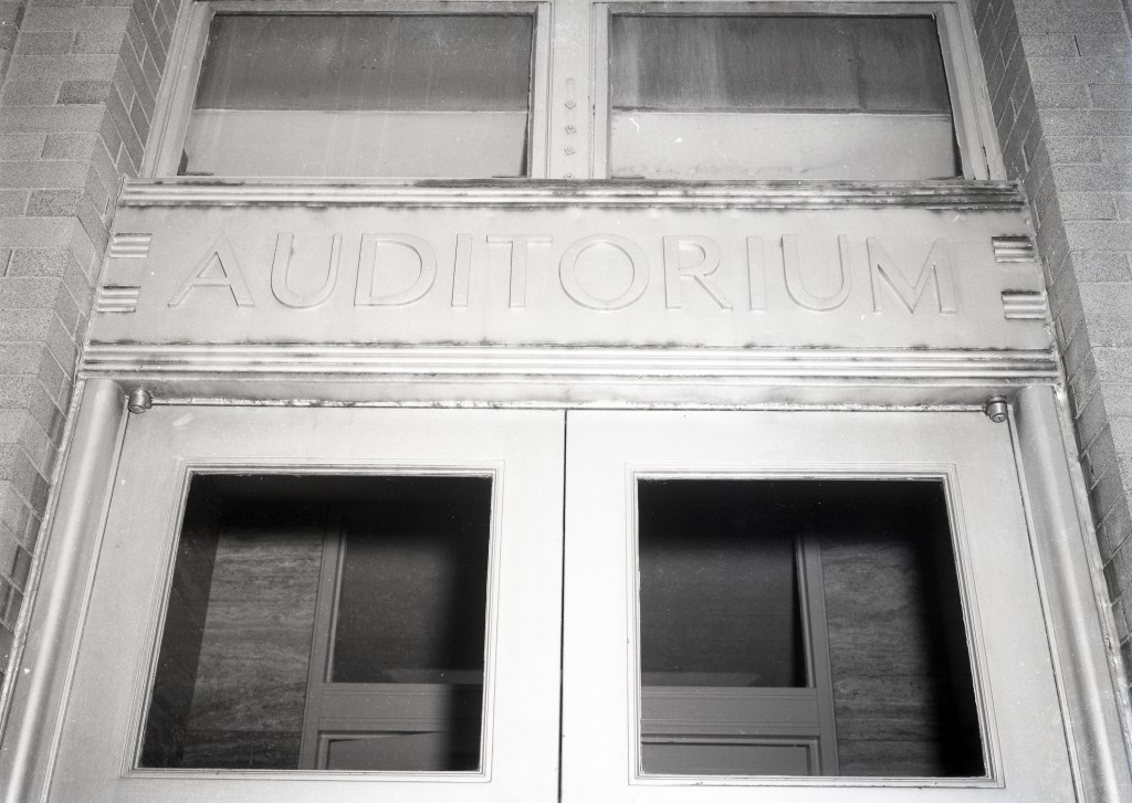 Auditorium lettering above doorway.