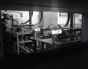 Three high-speed burner rigs on table in test cell.