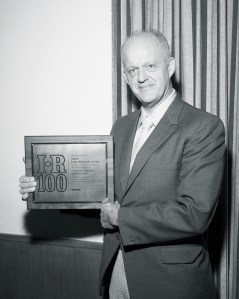 Man holding plaque.