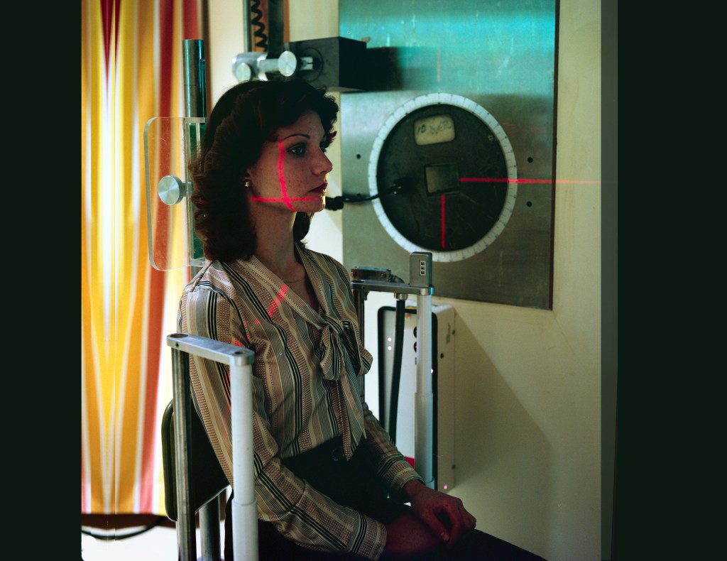 Woman sitting in chair.