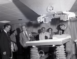 Group inspecting gurney.