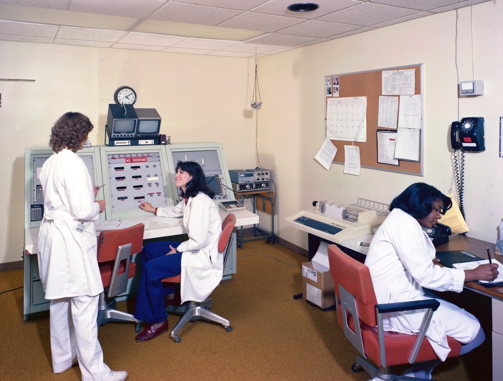 Nurses in control room.