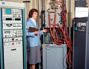 Woman examining test equipment.