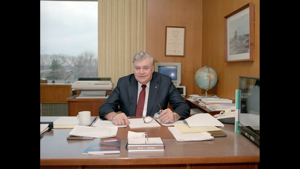 Man sitting at desk.