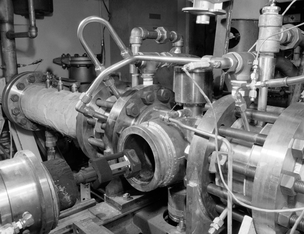test specimen being inserted into the test section or rig.