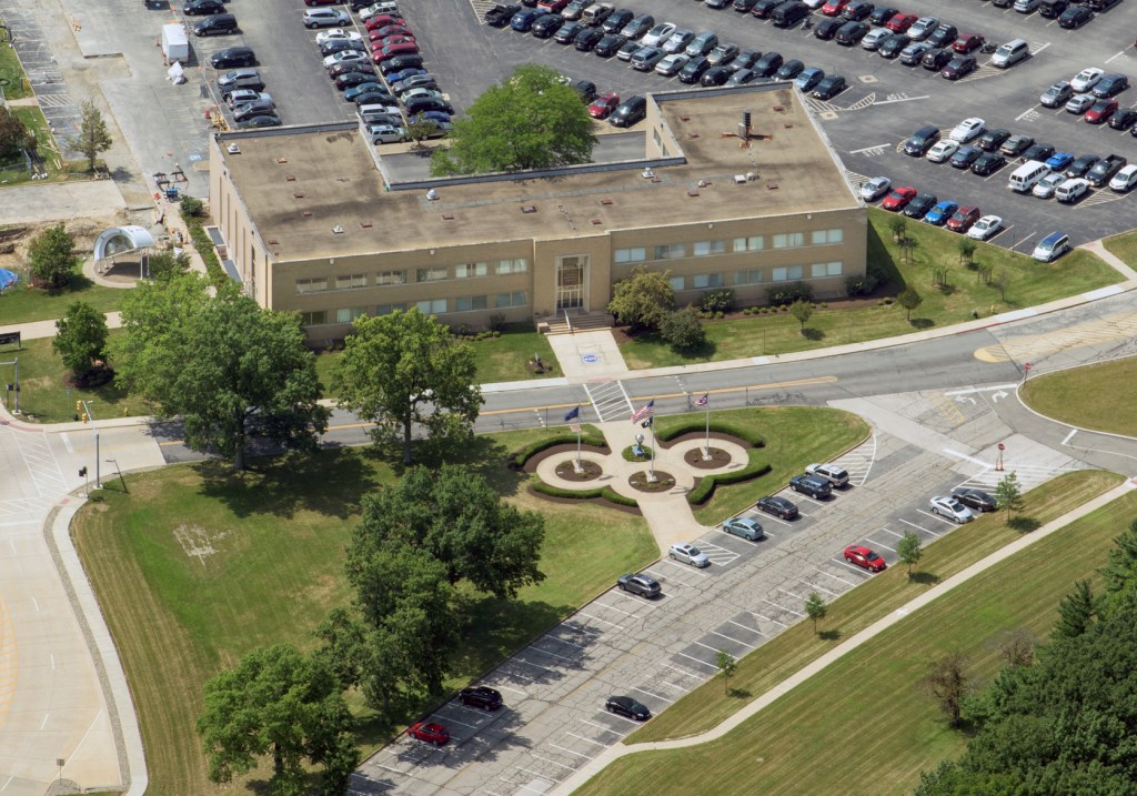 Aerial view of office building and surrounding area.