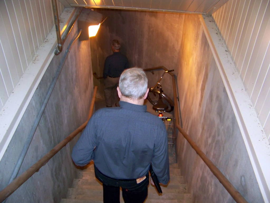 Man descending stairwell.