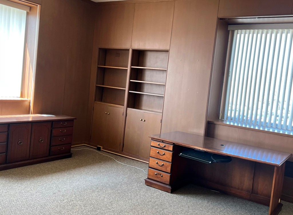Empty office with paneling.