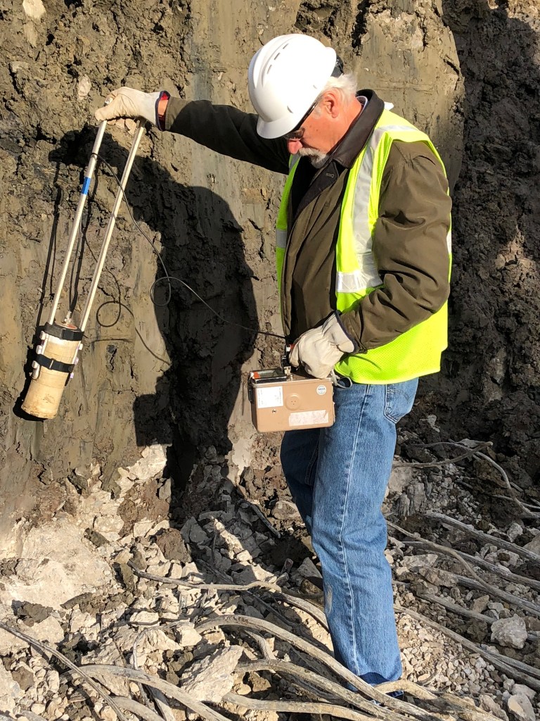 Man measuring radiation.