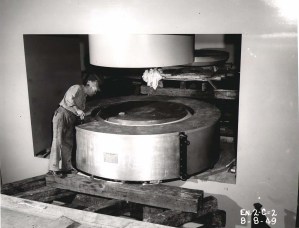 Man examining two large magnets.