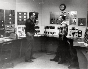 Men in control room.