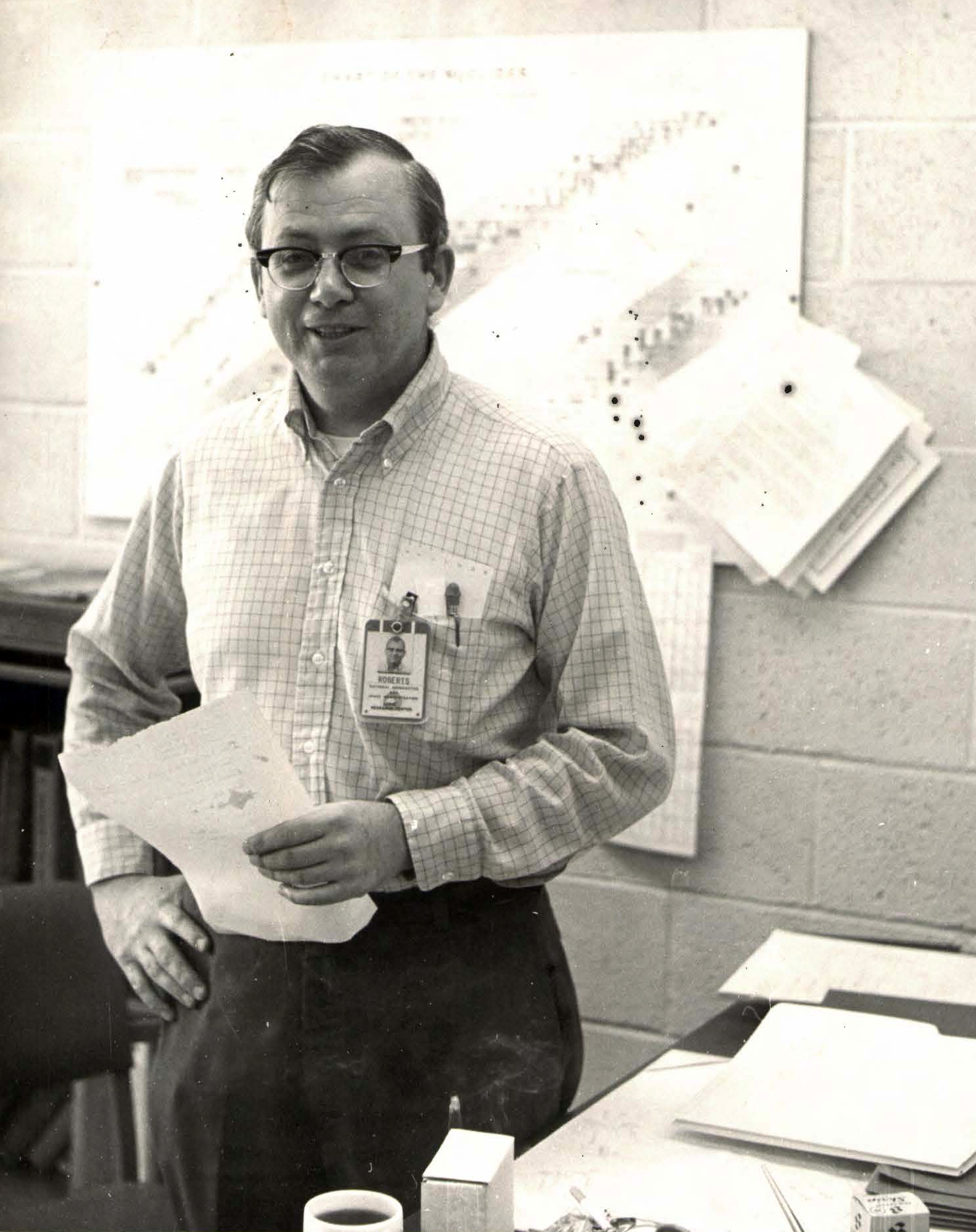 Man standing in office.