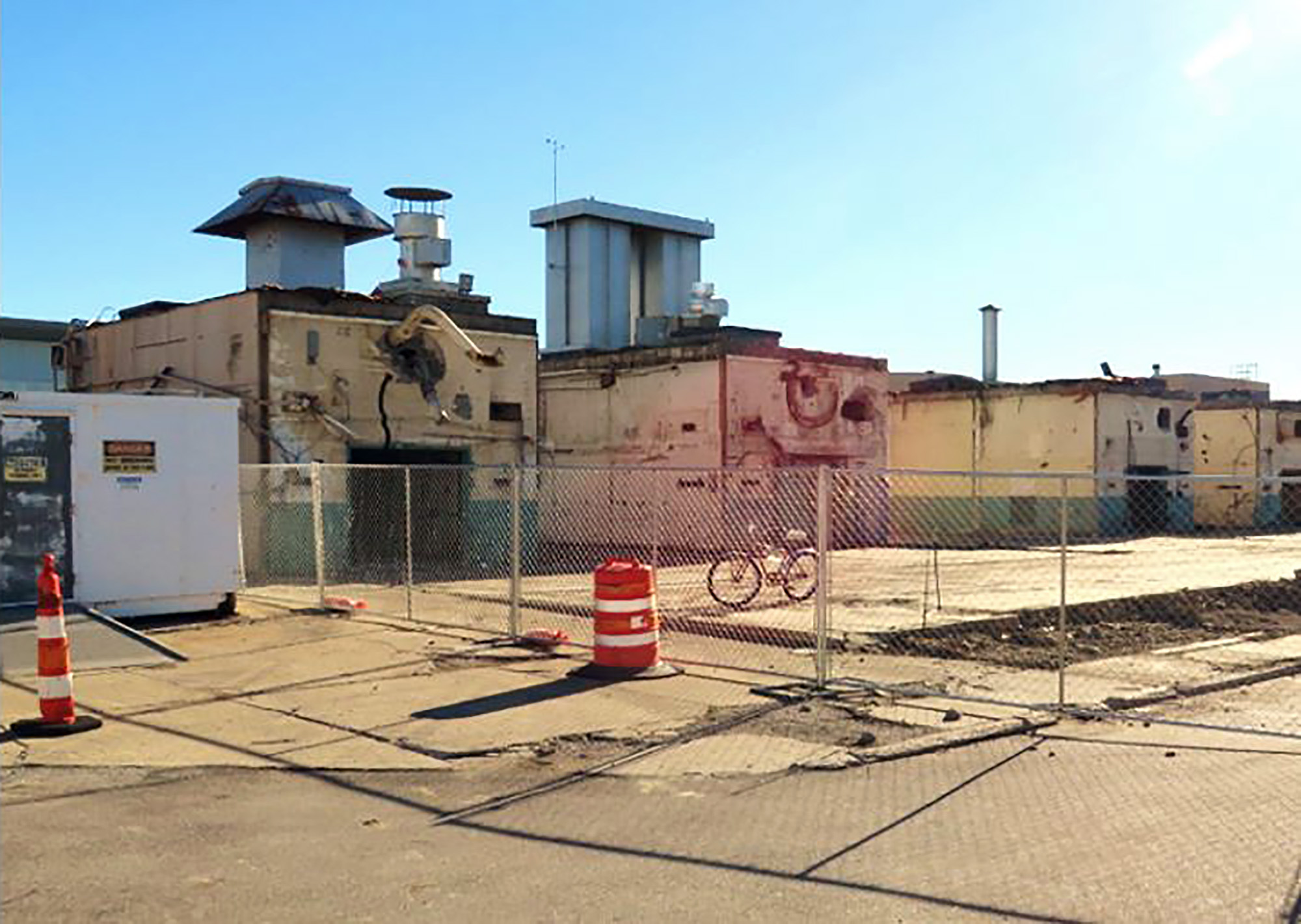 SPL exterior demolition of bicycle in foreground.