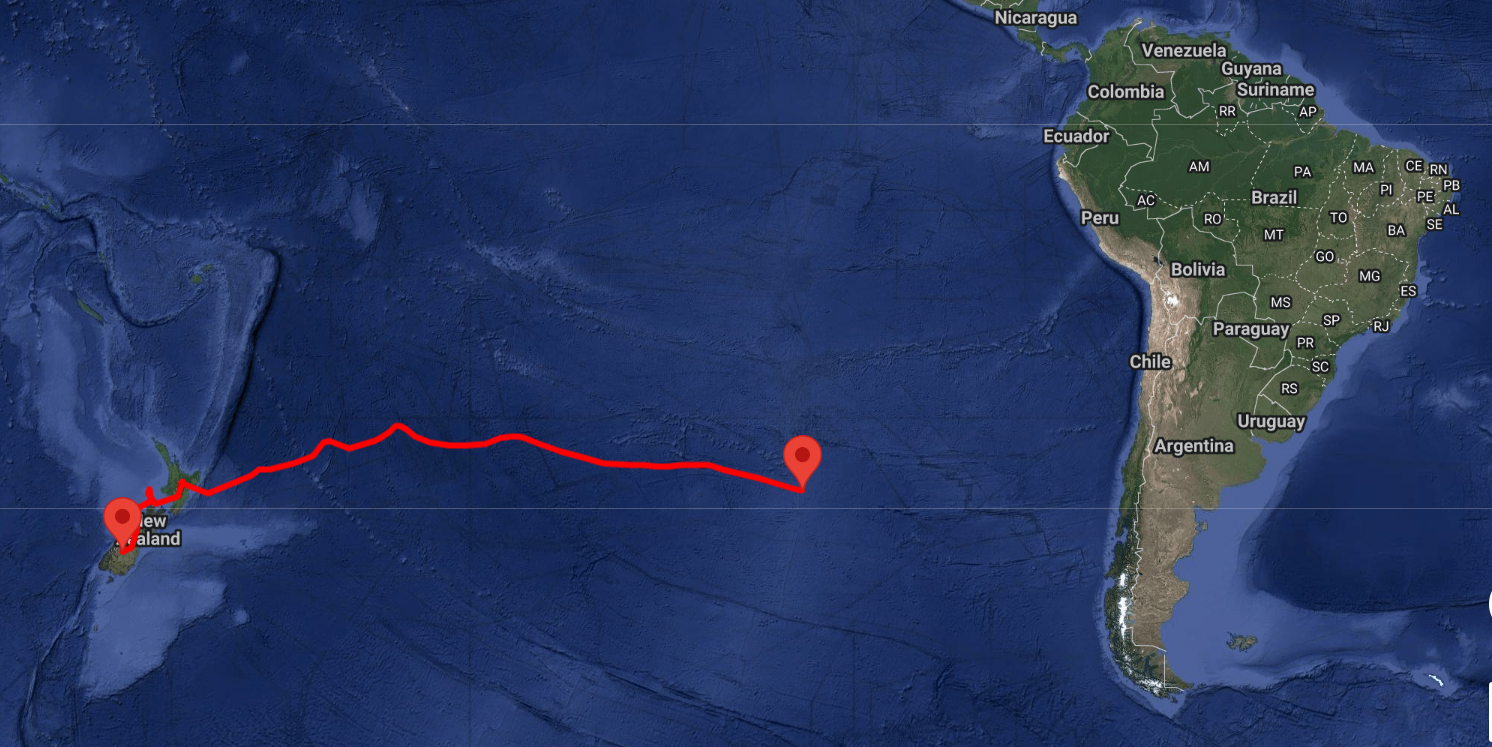 A world map with green land masses and blue ocean, and a red line representing a flight path of a balloon.