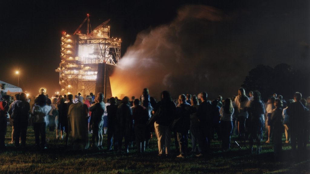 Thousands of people gathered to view the first-ever evening public engine test of a space shuttle main engine at NASA Stennis