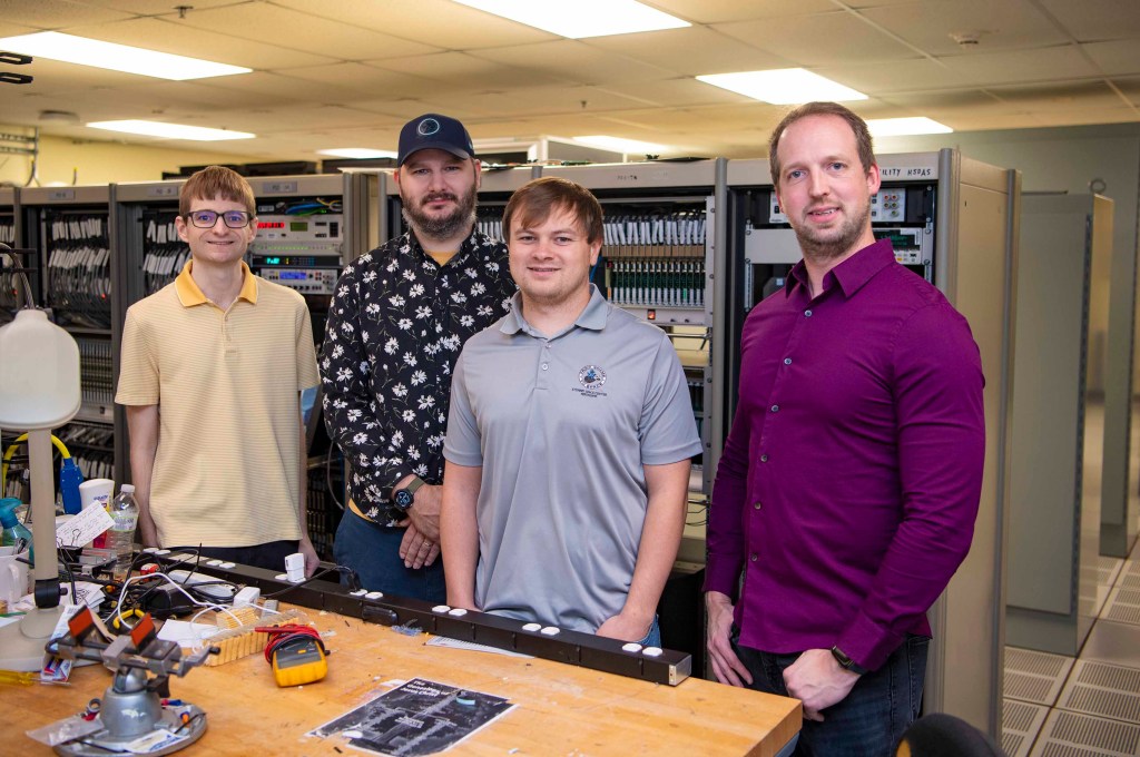 NASA engineers are shown in the E-1 Test Control Center